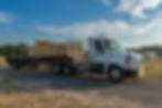 RoMac Roller Truck delivers trusses to a job site in Sumter County, Florida