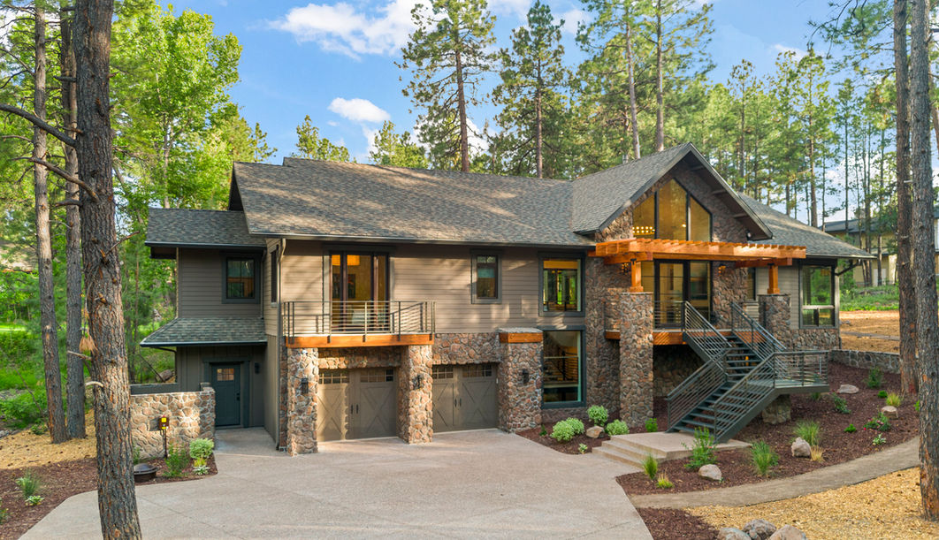 rock facade metal roof custom staircase tile work hardwood flooring