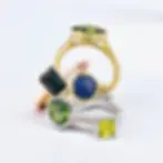 stack of coloured emerald rings