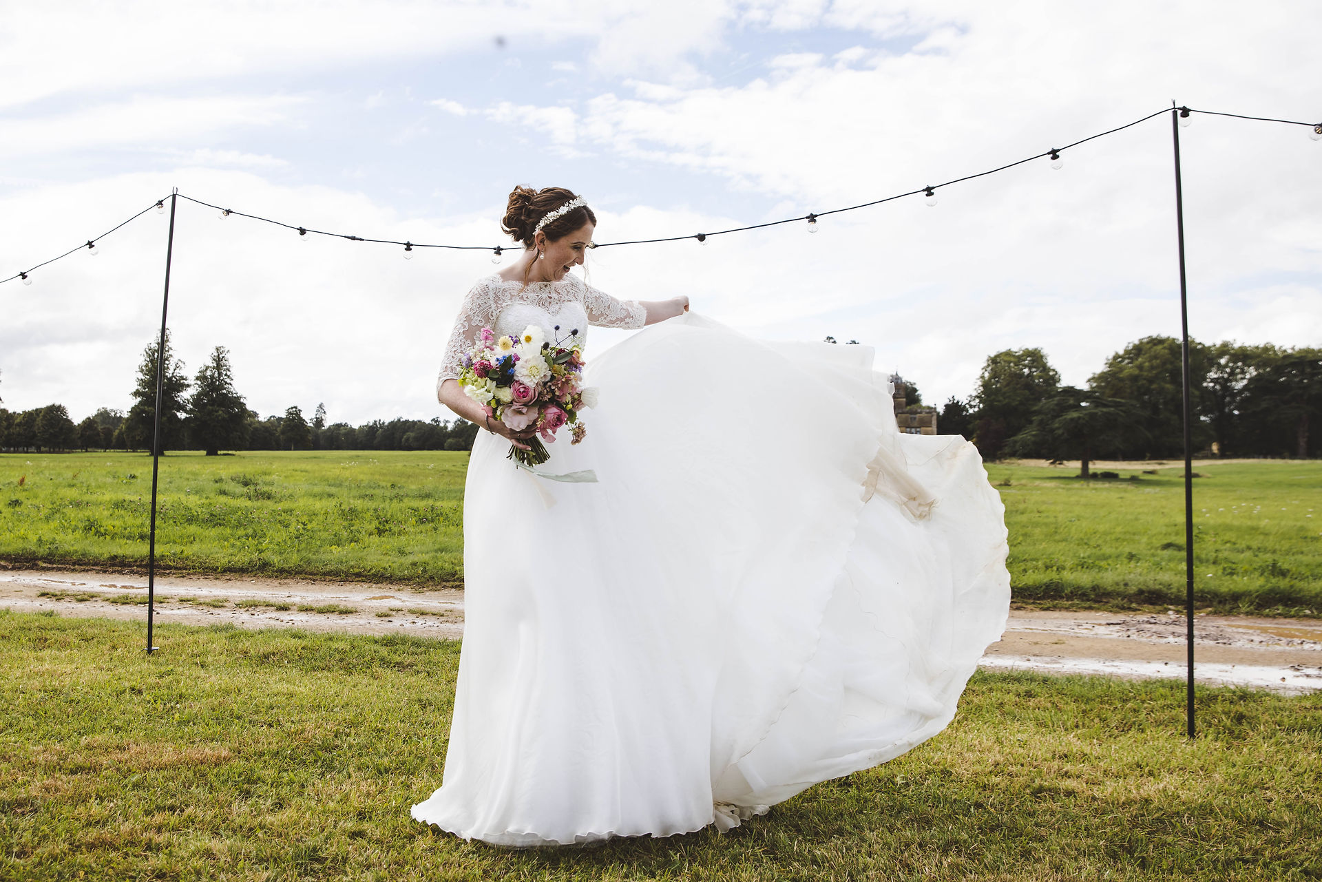 Bride showing the floaty skirt of her dress