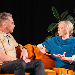 Chris Packham and Deborah Meaden sat discussing the climate on an orange sofa