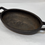 Thumbnail: Vintage Cast Iron Mini Oval Pan with Handles Designed for Cooking and Serving In