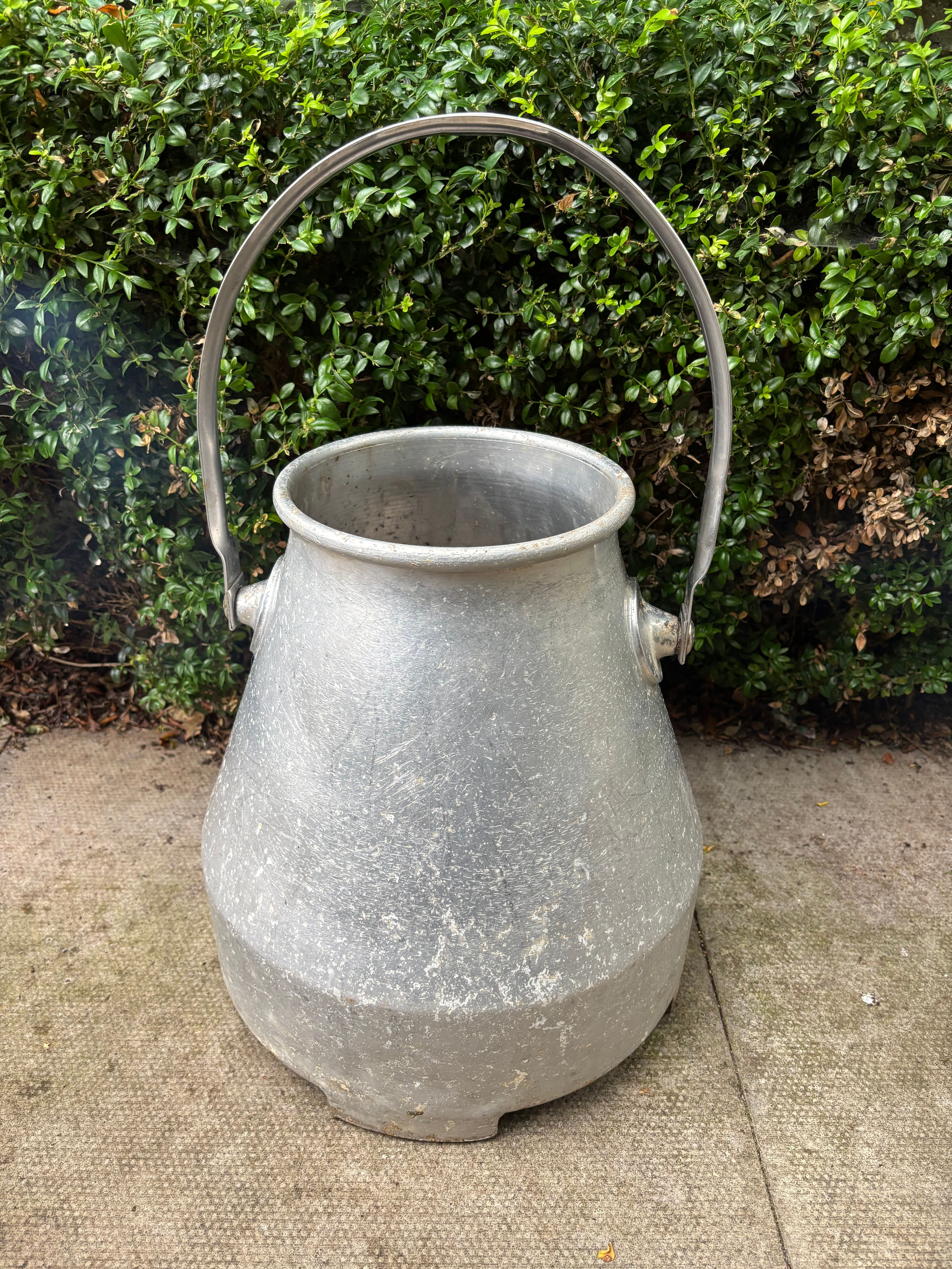 Vintage aluminum milk churn (also commonly referred to as a milking bucket or p