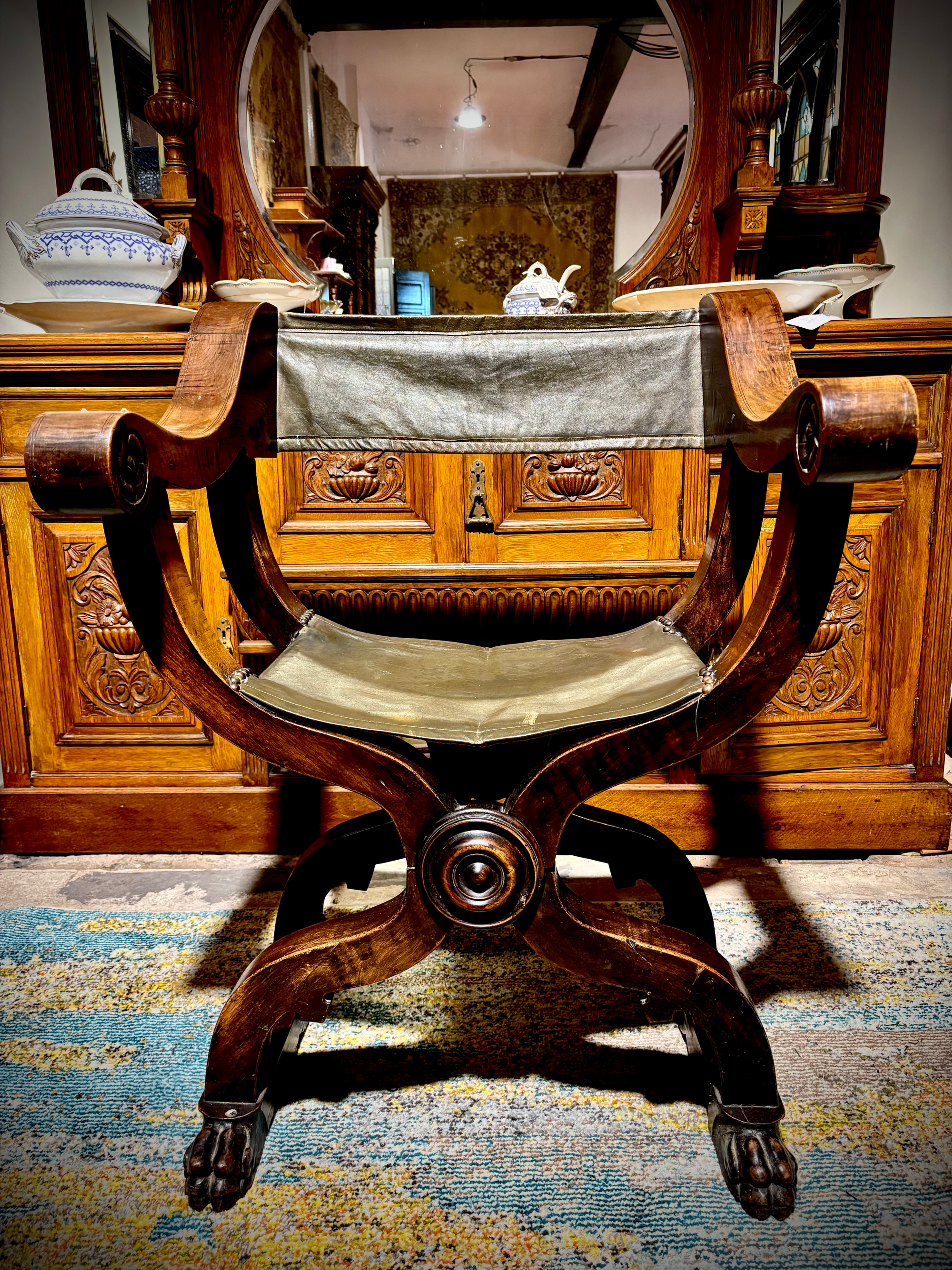 Antique 19th Century Savonarola foldable leather and carved wooden chair. 
