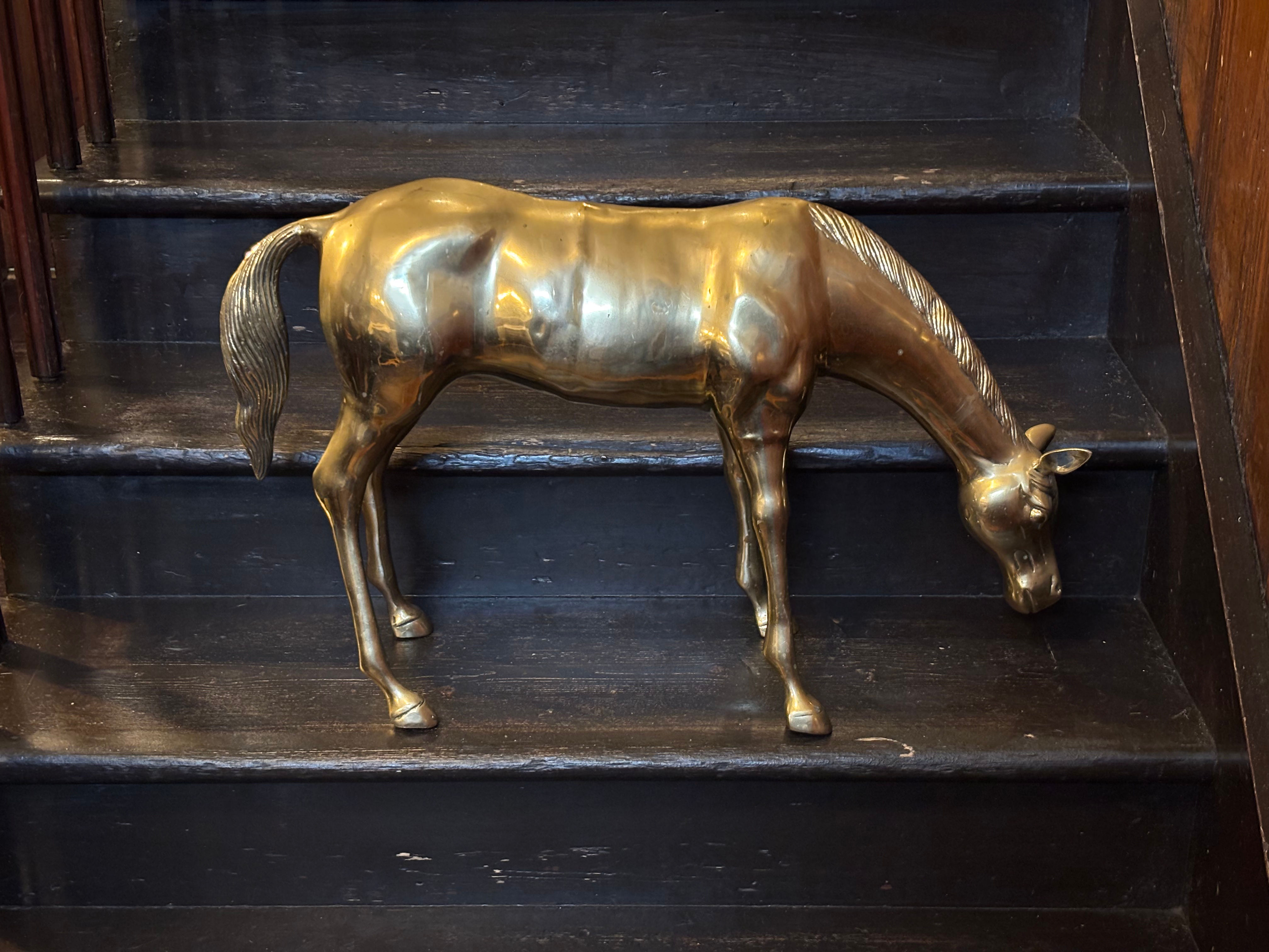 Huge vintage mid-century brass "grazing horse" statue.