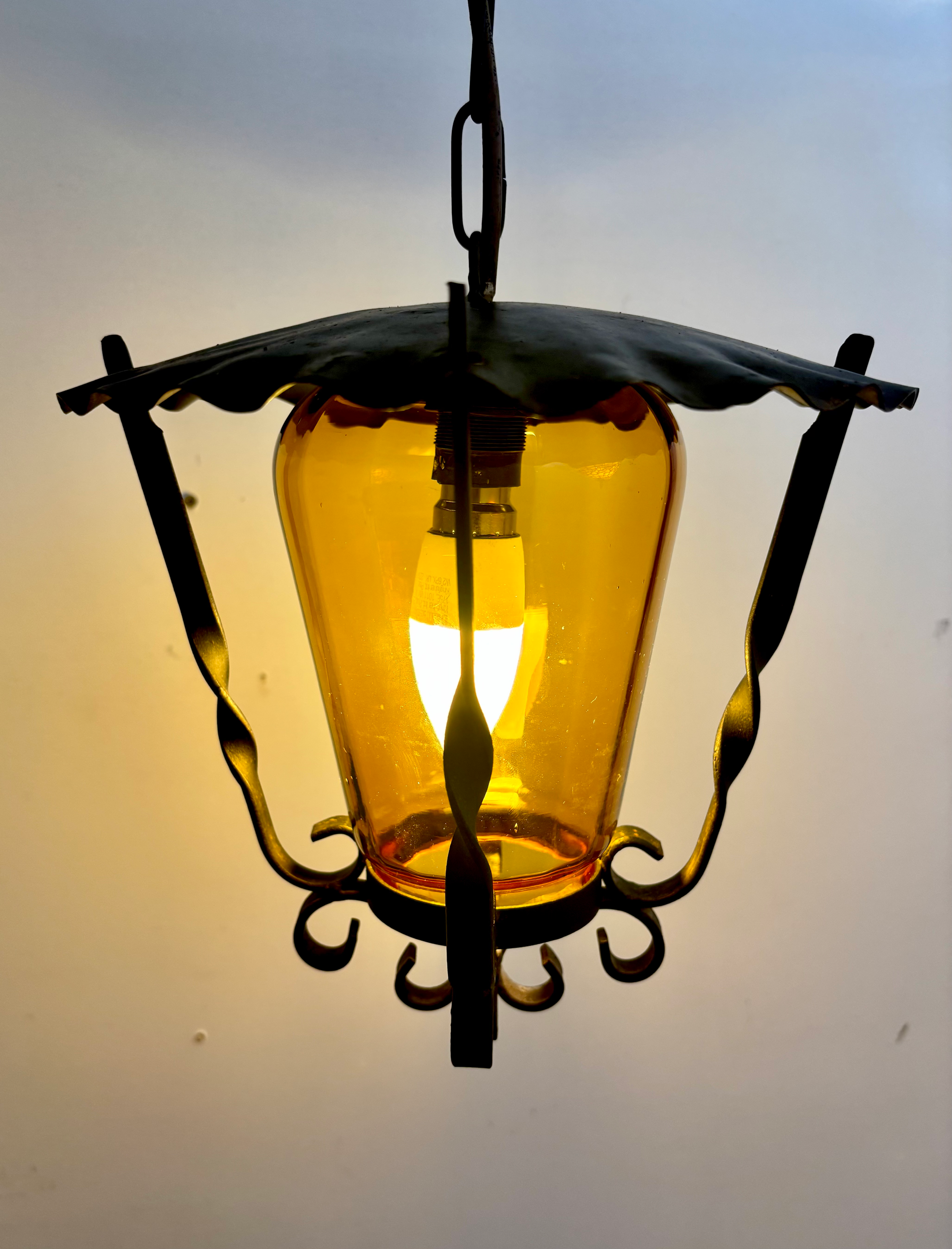 Mid-Century Wrought Iron Lantern Pendant with Amber Hand Blown Glass Shade. 