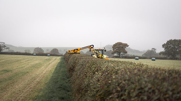 Agricultural contractors hedgecutting on a staffordshire farm