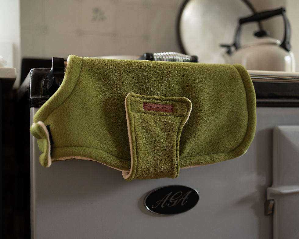 Country fleece dog coat drying over the aga in a country home