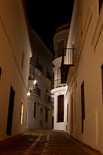 Looking up Calle José Castrillón, Vejer at night.