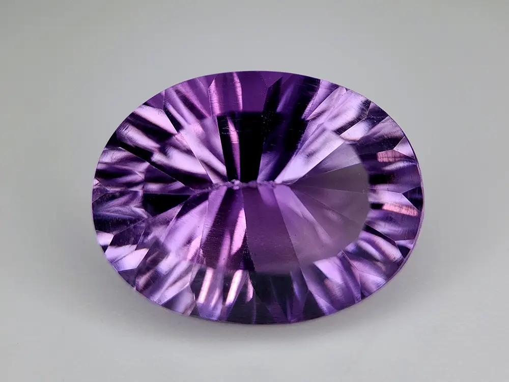 Amétrine ovale 8.08 ct, taille concave Sunburst, violet intense, Bolivie naturelle.