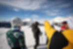 Skiers skiing around the slopes in the Dolomites with a ski guide
