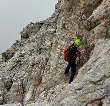 Climber on the second section of Via Ferrata delle Mesules in the Dolomites