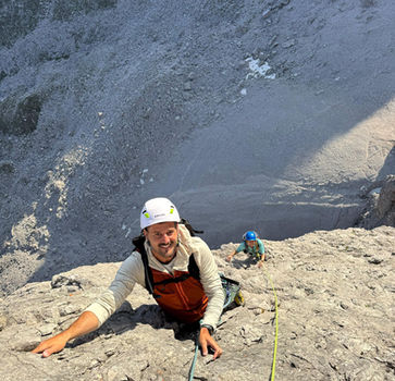 Climber on exposed limestone terrain on Cima Grande di Lavaredo