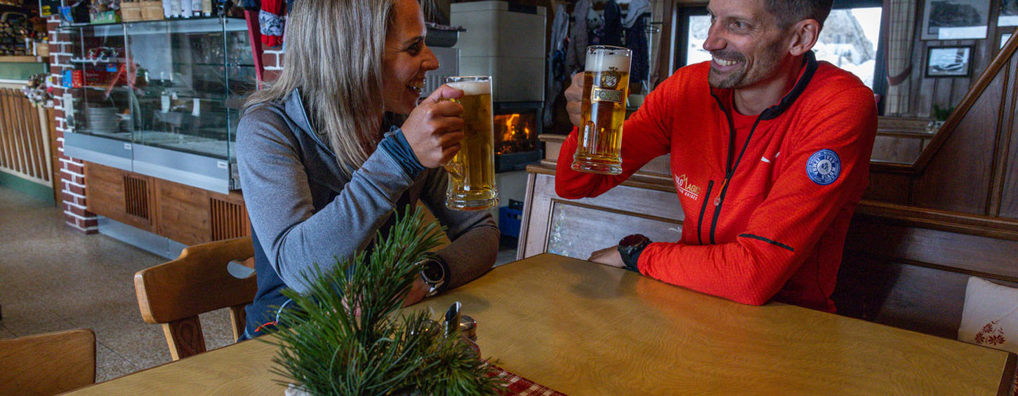 Climbers relaxing at Rifugio Toni Demetz after climbing in Sassolungo Dolomites