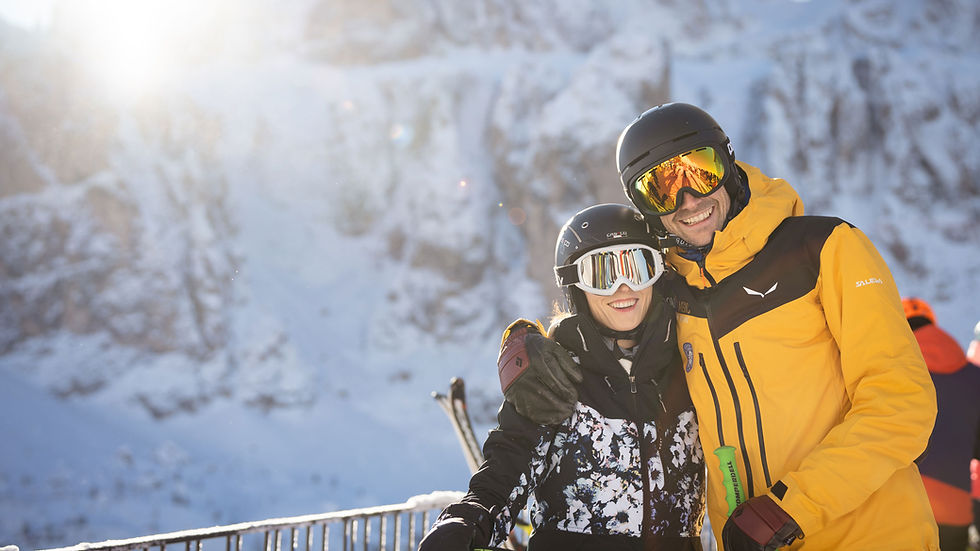 Skiing couple in the Dolomites