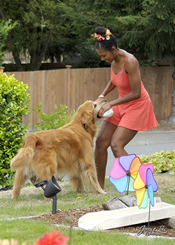 Taylor-Boyd and Ranger have a special bond whether the dog is working or during playtime like this tug-of-war.