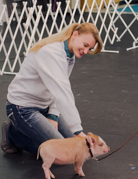 Instructor Jayne Bosch positions Amy with a training technique.