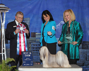 Tia McLaughlin, of Puyallup, and Madonna, a Lhasa Apso, took top honors at Sunday’s all-breed show. Judge Vincent Grosso, of Banning Calif., and Seattle Kennel Club member Leslie Engen are beside the winner. 