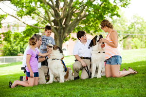 Bill and Laura Gordons' St. Bernards, Rosie and Clarence, were popular with parents and children at the Newtown thank-you ceremony for the therapy-dog teams in late June. The Gordons are Greenfield, Mass., police officers.