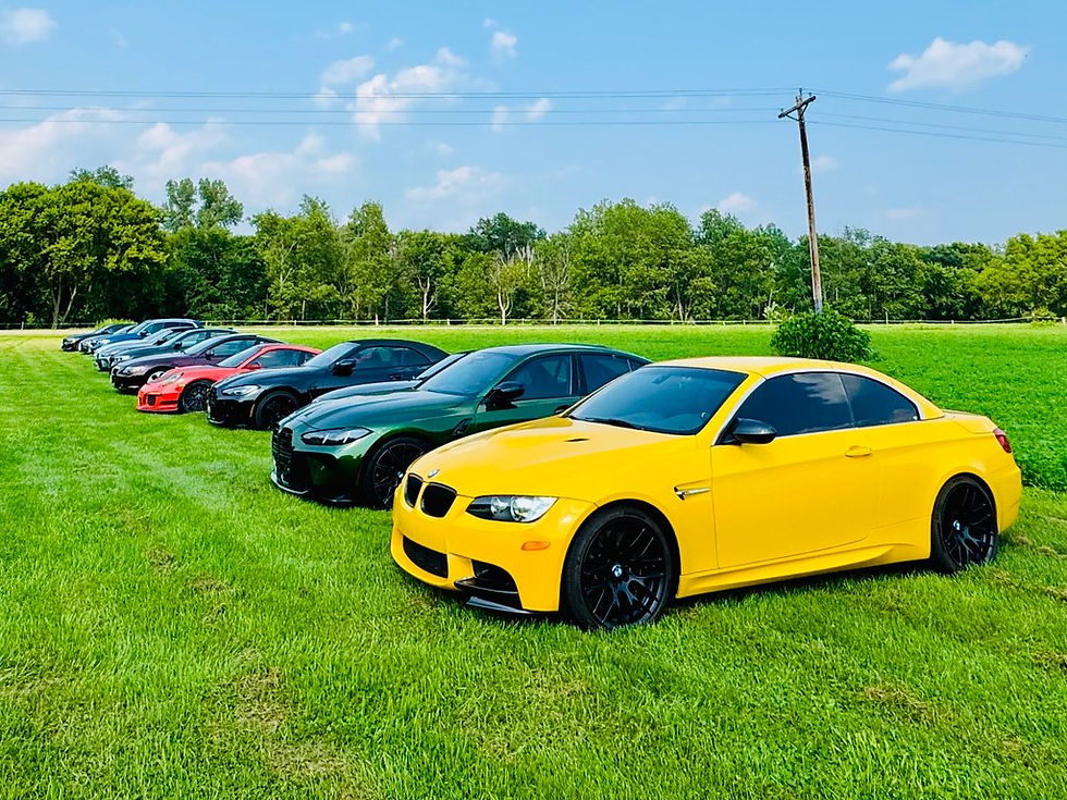 A stack of cars in a field of green during the 2025 Pizza Run