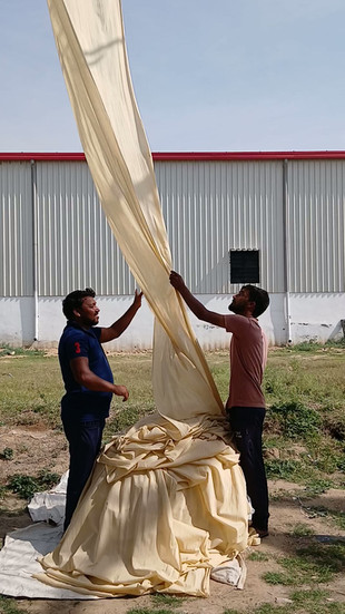 Dried fabric being gathered ready for dyeing
