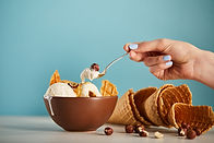 cropped-view-of-woman-with-spoon-bowl-of-ice-crea-2023-11-27-05-19-59-utc.jpeg
