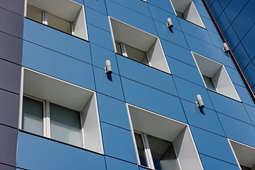 vecteezy_generic-blue-office-building-wall-with-windows-and-composite_32989890.jpg