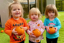 Waddlers with pumpkins at Cosmopolitan Kids daycare in Seattle