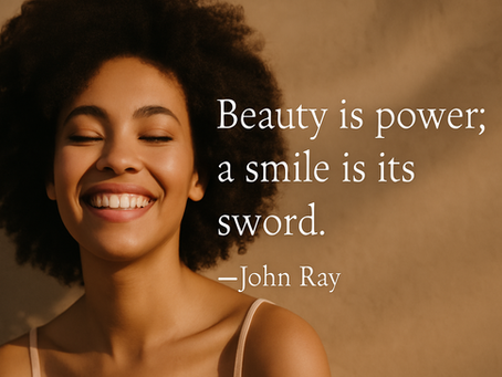 Smiling person with curly hair against a brown background. Text: "Beauty is power; a smile is its sword." –John Ray. Relaxed mood.