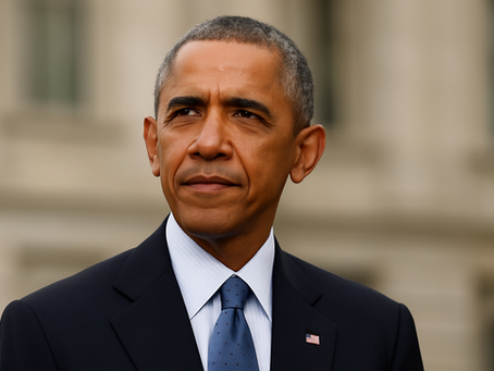 Barack Obama. A person in a dark suit with a small flag pin stands outdoors, looking thoughtful. Blurred building in the background. Neutral expression.
