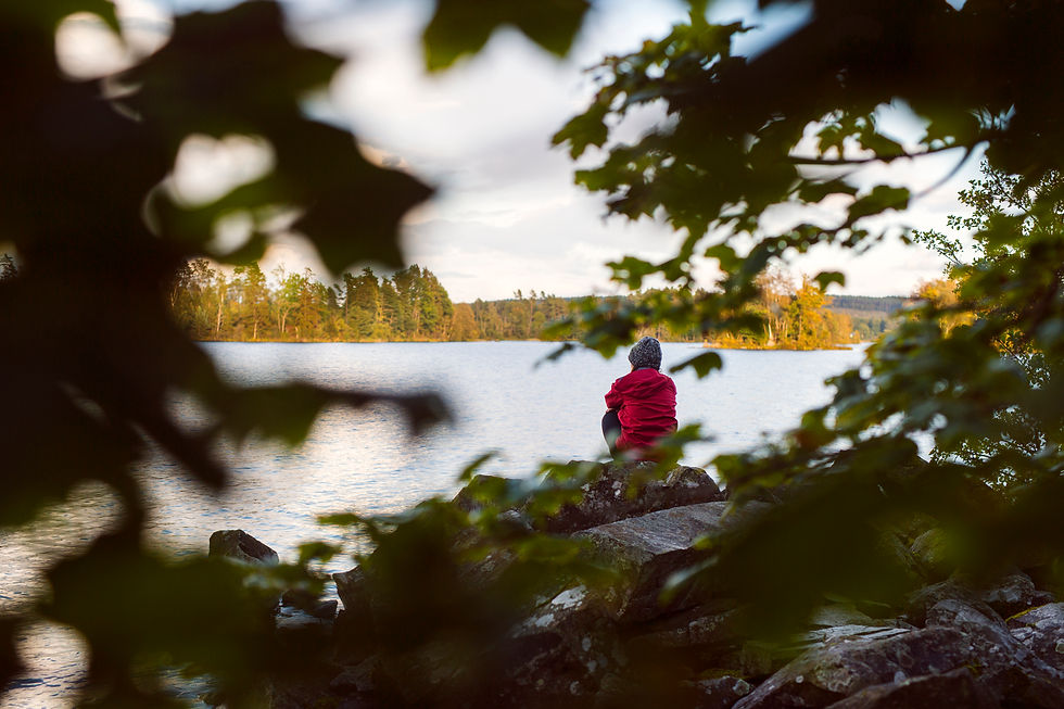 hiker-sitting-on-riverbank-and-looking-at-view-2026-03-09-22-08-33-utc.jpg