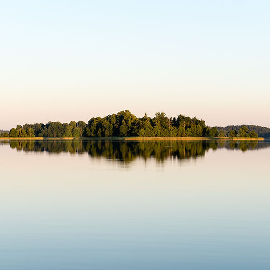 symmetric-reflections-on-calm-lake-water-with-fore-2026-01-09-14-21-40-utc.jpg