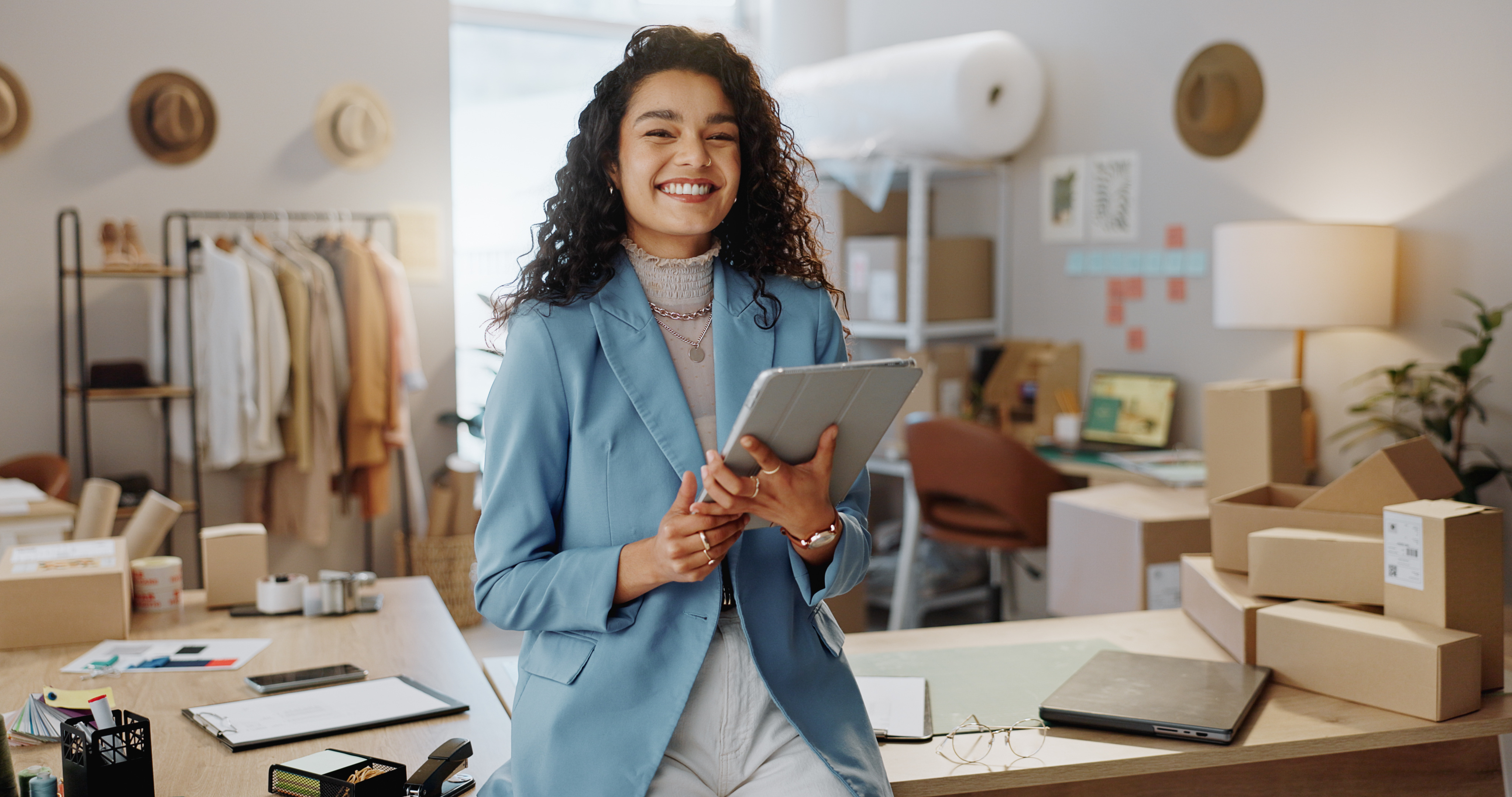 happy-woman-portrait-fashion-designer-with-tablet-logistics-small-business-management-bout