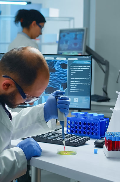 scientist-putting-blood-sample-from-test-tube-with-micropipette-petri-dish-analysing-chemi