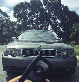 Remote car key fob with lock and unlock buttons