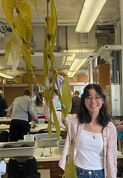 Science writer Sarah Matysiak holding seaweed