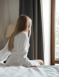 woman awake from sleep getting sunlight