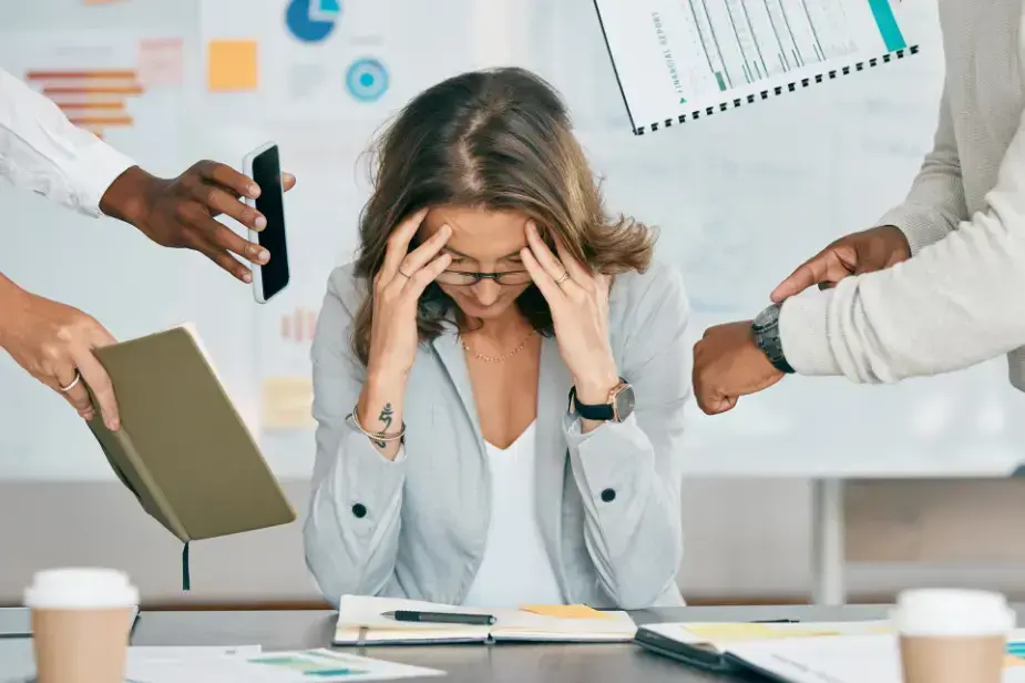 A stress women surrounded by multiple work