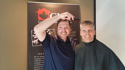 Garth Lyon and Sam Samdi shaving heads for a cause