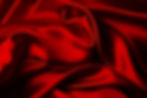 Closeup of ripples in red silk fabric.jp