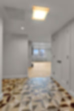 Upper West Side condo renovation – grand entryway with marble tile and custom millwork
