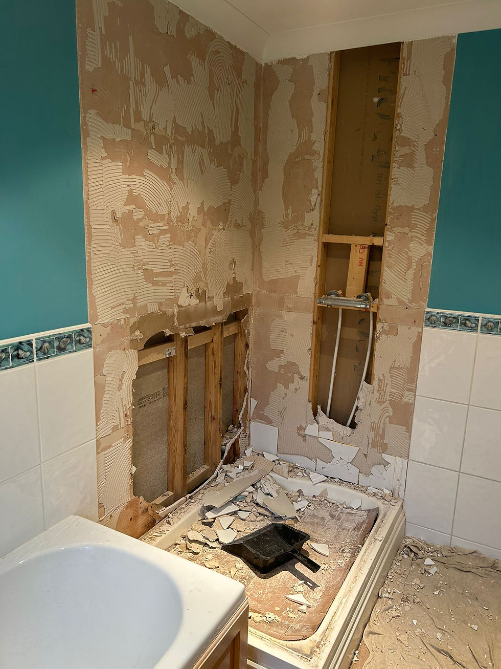 Shower wall repair and tile replacement.