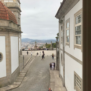 View from interior of a building overlooking Portugal, people walking. Portugal Travel