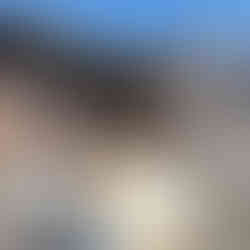 Brown building with steps, small porch and several windows. Portugal Travel.