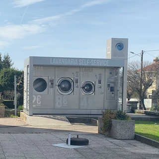 Lavandaria Self-Service washing machine with text, 2€, 8€ and 4€. Portugal Travel