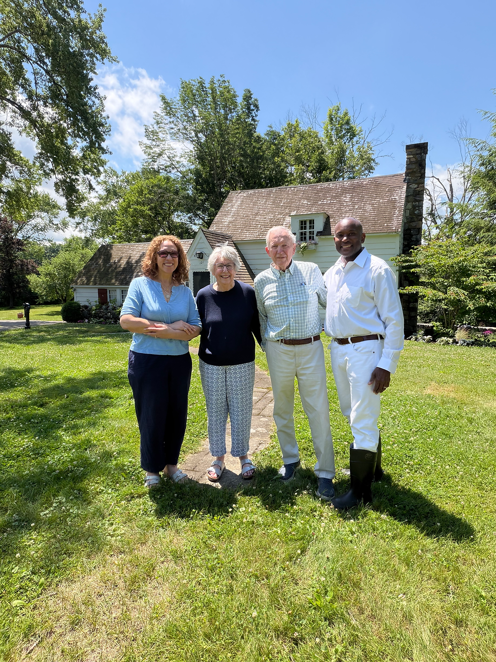 Bruce Wood, his wife, Melody, Jill Rosenberg Jones, and Rufus E. Jones, President of the James Weldon Johnson Foundation, in front of 5 Acres, Great Barrington