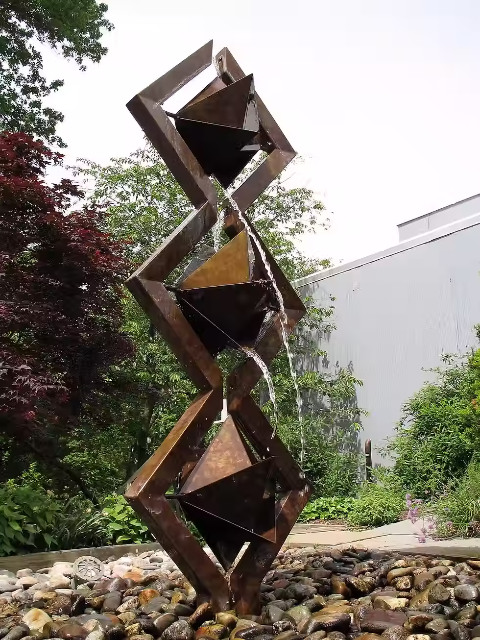 "L’Dor V’Dor," a bronze water sculpture, channels flowing streams through interlocking geometric forms. Meaning “From Generation to Generation,” it symbolizes continuity, resilience, and the timeless power of water to renew and connect. Installed in institutions across the U.S., this sculpture bridges ancient symbolism with contemporary design, reminding us that the flow of life, and culture, never ceases.