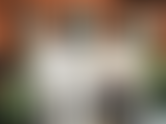 Artist Raine Storey working in fronf of her new sculpture