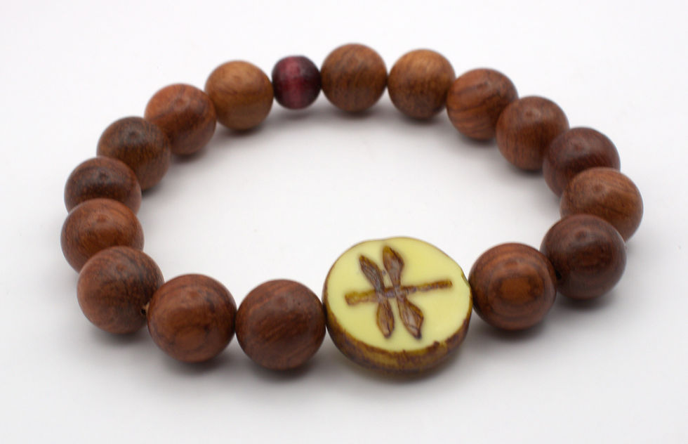 wood beaded stretch bracelet with dragonfly etched center bead