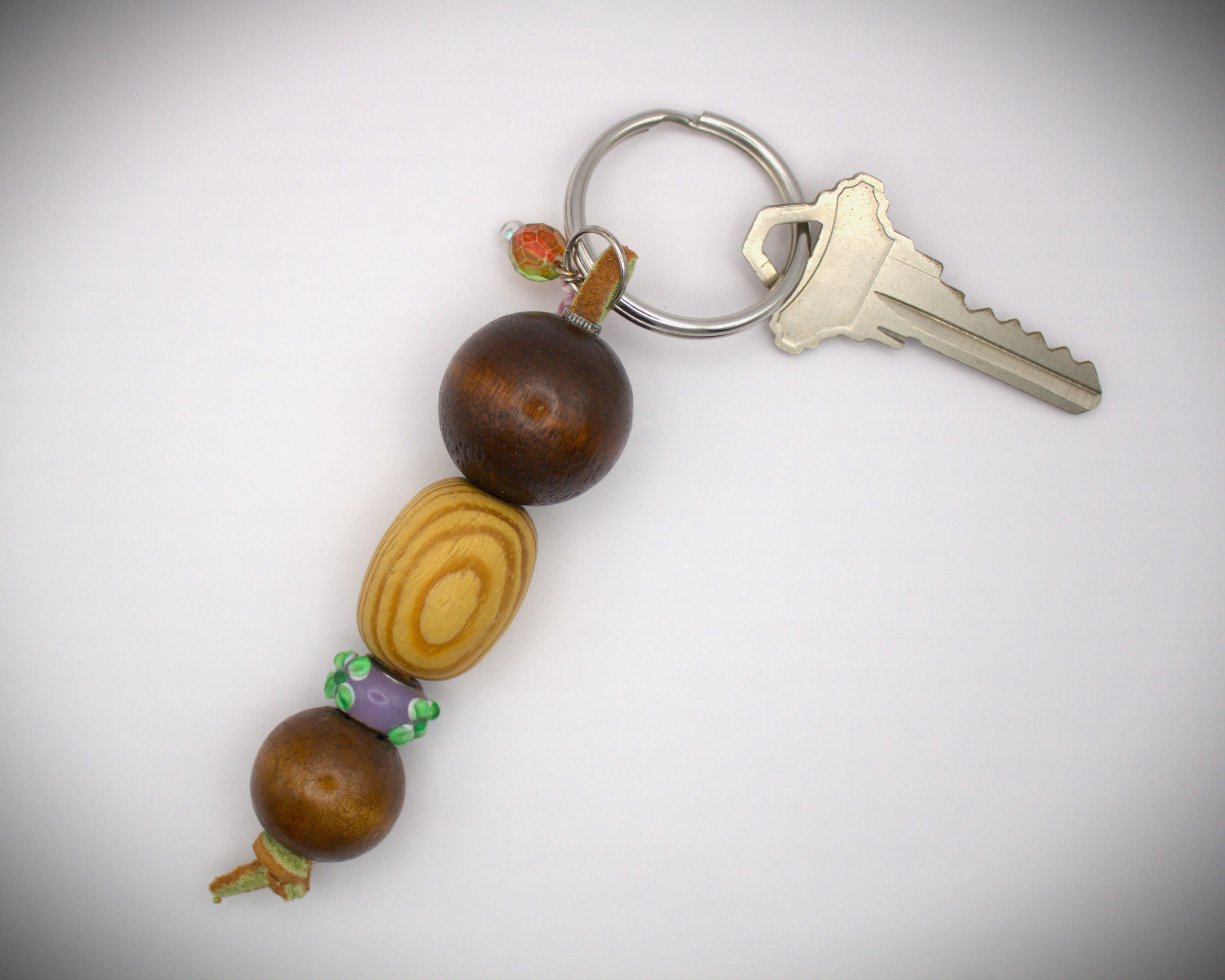 Beaded Key Chain, with round dark coconut beads & an oval blonde wood bead